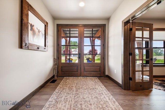 16 Tight Loop Dr, Bozeman, MT 59718 - entryway featuring french doors, wood finished floors, and plenty of natural light
