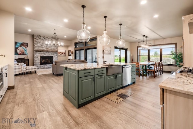 16 Tight Loop Dr, Bozeman, MT 59718 - kitchen with appliances with stainless steel finishes, a large fireplace, light wood finished floors, a chandelier, and recessed lighting