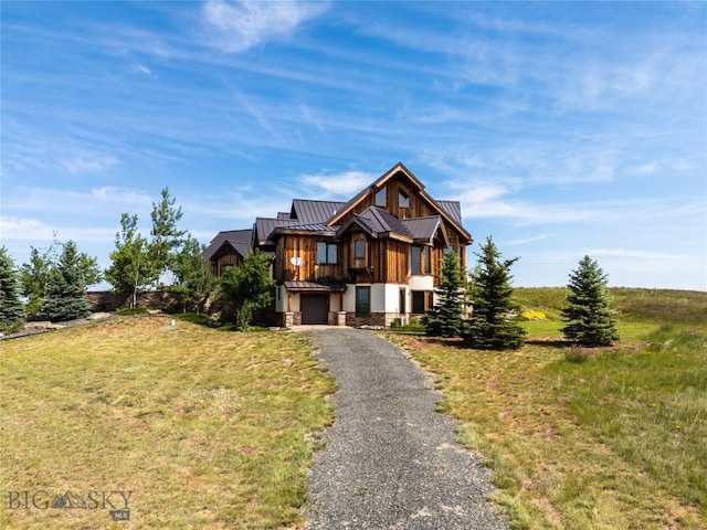 155 Peacemaker Ridge Rd, Belt, MT 59412 - view of front of property with a standing seam roof, a metal roof, asphalt driveway, an attached garage, and a front lawn