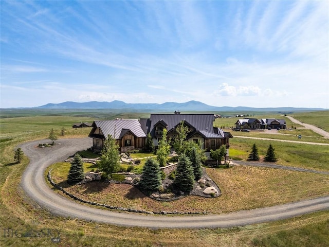 155 Peacemaker Ridge Rd, Belt, MT 59412 - view of front facade with a mountain view, driveway, and a metal roof