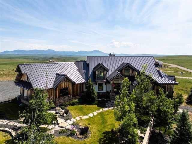 155 Peacemaker Ridge Rd, Belt, MT 59412 - view of front facade with a standing seam roof, a metal roof, a chimney, stone siding, and a mountain view