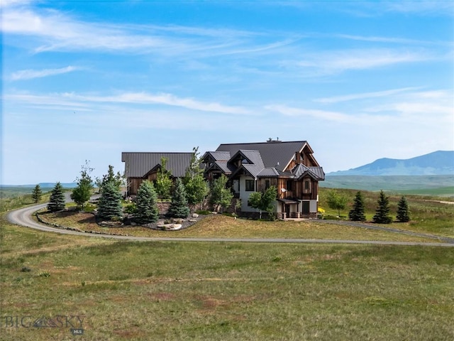 155 Peacemaker Ridge Rd, Belt, MT 59412 - view of front facade featuring a front lawn, a mountain view, and a metal roof