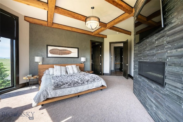 155 Peacemaker Ridge Rd, Belt, MT 59412 - carpeted bedroom featuring coffered ceiling, beamed ceiling, and a glass covered fireplace