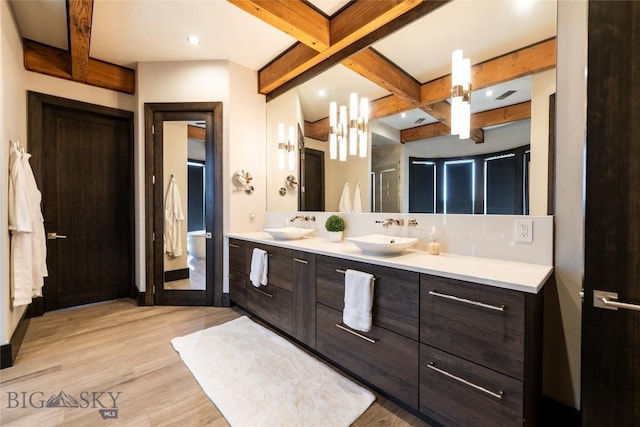 155 Peacemaker Ridge Rd, Belt, MT 59412 - bathroom with beamed ceiling, double vanity, wood finished floors, a stall shower, and recessed lighting