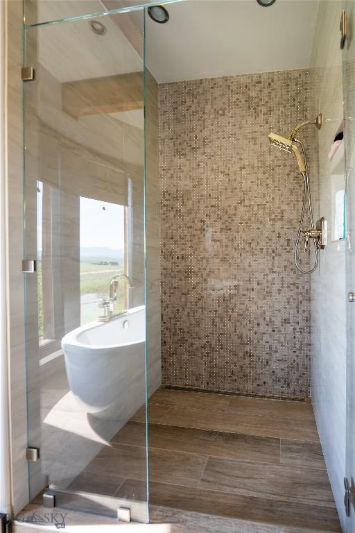 155 Peacemaker Ridge Rd, Belt, MT 59412 - full bathroom featuring a stall shower and a soaking tub