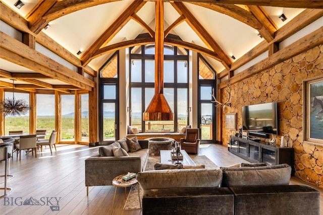 155 Peacemaker Ridge Rd, Belt, MT 59412 - living area with high vaulted ceiling, wood-type flooring, and beam ceiling