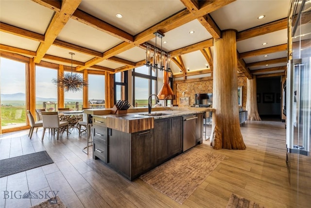 155 Peacemaker Ridge Rd, Belt, MT 59412 - kitchen featuring a chandelier, dishwasher, coffered ceiling, dark brown cabinets, and a center island with sink