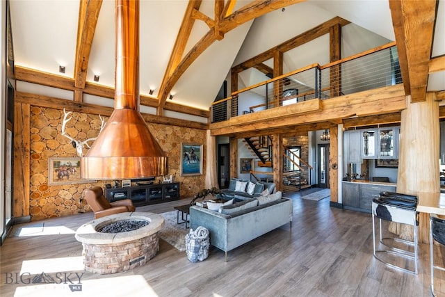 155 Peacemaker Ridge Rd, Belt, MT 59412 - living area featuring high vaulted ceiling, wood finished floors, beam ceiling, and stairs