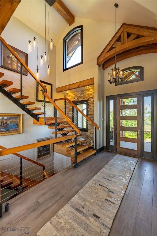 155 Peacemaker Ridge Rd, Belt, MT 59412 - foyer entrance with high vaulted ceiling, stairway, hardwood / wood-style flooring, plenty of natural light, and beamed ceiling