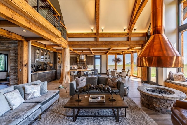 155 Peacemaker Ridge Rd, Belt, MT 59412 - living room featuring beamed ceiling, wood finished floors, and bar area