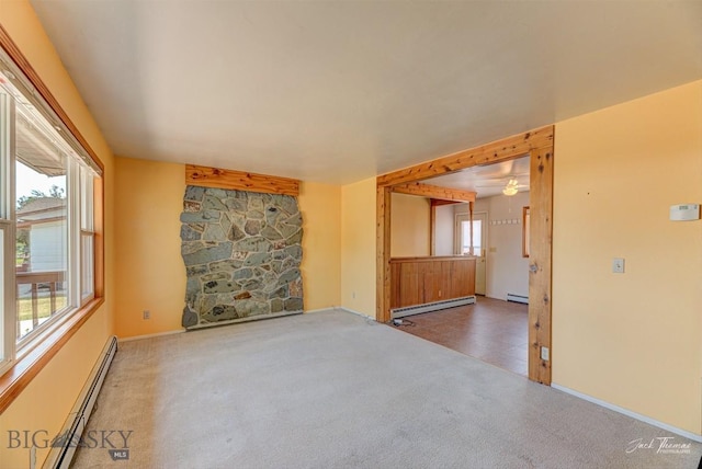 425 Russell, Helena, MT 59602 - carpeted spare room featuring baseboard heating and a baseboard heating unit