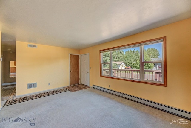 425 Russell, Helena, MT 59602 - unfurnished room with a baseboard heating unit and carpet flooring