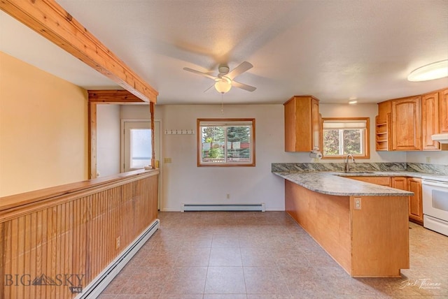 425 Russell, Helena, MT 59602 - kitchen with a baseboard radiator, a ceiling fan, a peninsula, and healthy amount of natural light