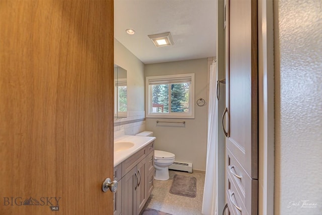 425 Russell, Helena, MT 59602 - bathroom featuring a baseboard heating unit, vanity, and a shower with curtain
