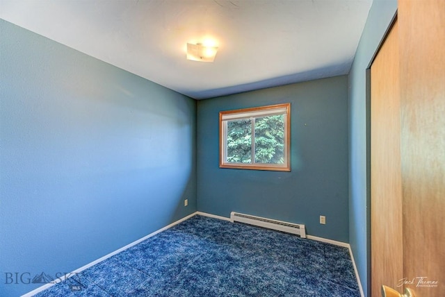 425 Russell, Helena, MT 59602 - carpeted spare room featuring a baseboard radiator and baseboards