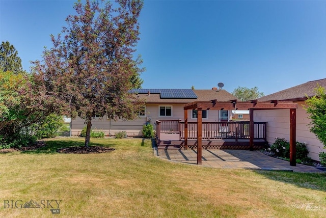 425 Russell, Helena, MT 59602 - back of house with solar panels, a wooden deck, a patio, and a yard