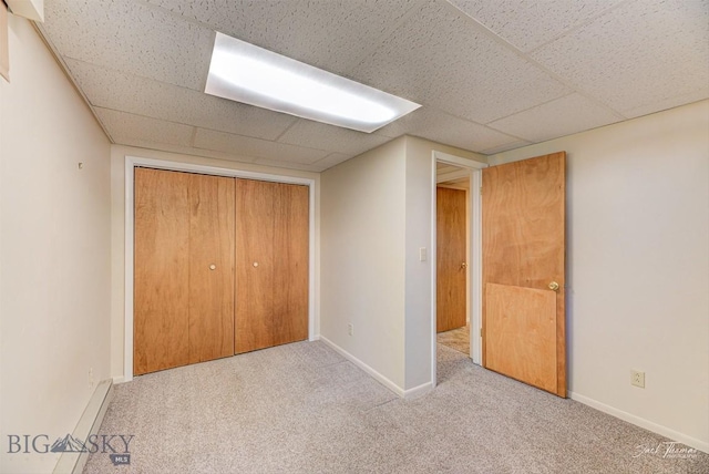 425 Russell, Helena, MT 59602 - unfurnished bedroom with carpet, a drop ceiling, and a closet