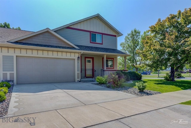 9 Sand Piper, Helena, MT 59602 - view of front of home featuring covered porch, an attached garage, driveway, a front lawn, and a shingled roof
