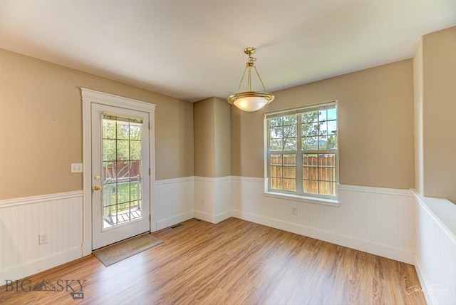 9 Sand Piper, Helena, MT 59602 - unfurnished dining area featuring wainscoting and light wood-style flooring
