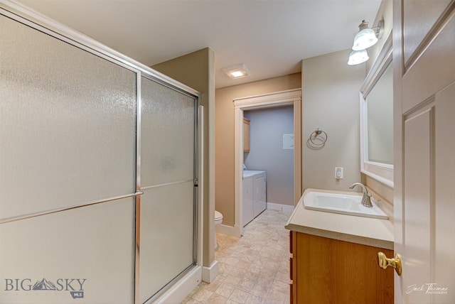 9 Sand Piper, Helena, MT 59602 - bathroom featuring washing machine and dryer, vanity, and a stall shower