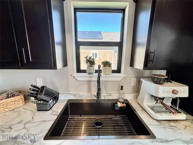 165 Johnson Ave, Dillon, MT 59725 - kitchen view of dark cabinetry and light stone countertops