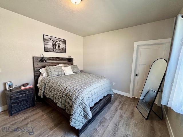 165 Johnson Ave, Dillon, MT 59725 - bedroom with wood finished floors and baseboards