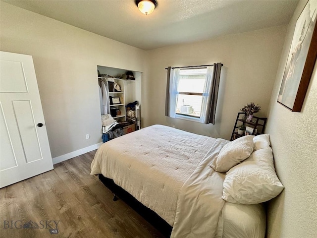 165 Johnson Ave, Dillon, MT 59725 - bedroom featuring wood finished floors and a closet