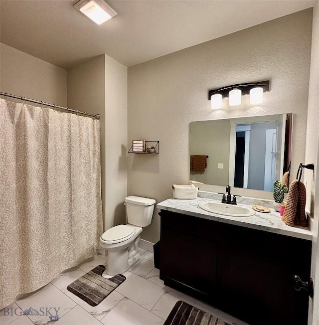 165 Johnson Ave, Dillon, MT 59725 - bathroom with marble finish floors, vanity, and a shower with curtain