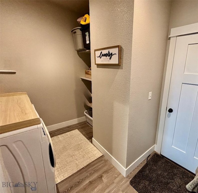 165 Johnson Ave, Dillon, MT 59725 - laundry area with wood finished floors and washing machine and clothes dryer