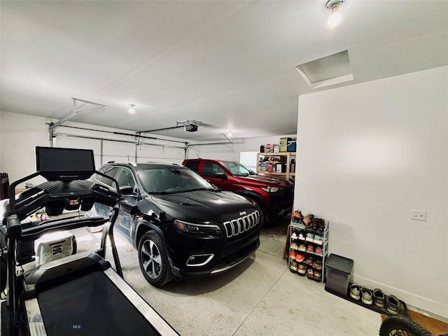 165 Johnson Ave, Dillon, MT 59725 - garage featuring a garage door opener and baseboards
