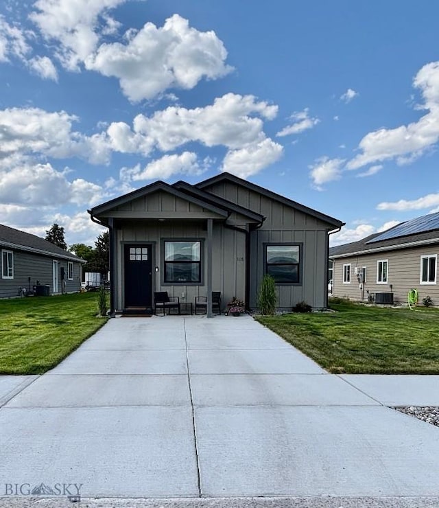 165 Johnson Ave, Dillon, MT 59725 - view of front of property with board and batten siding and a front yard