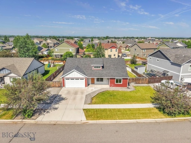 343 Stewart Loop, Bozeman, MT 59718 - view of front of property with a residential view, concrete driveway, a shingled roof, and a garage