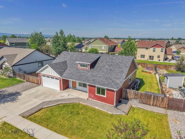 343 Stewart Loop, Bozeman, MT 59718 - traditional-style home with a residential view, roof with shingles, an attached garage, concrete driveway, and board and batten siding