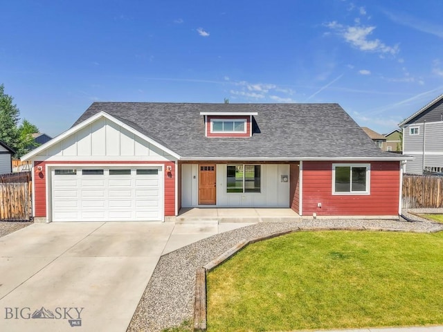 343 Stewart Loop, Bozeman, MT 59718 - view of front facade with covered porch, board and batten siding, an attached garage, and driveway