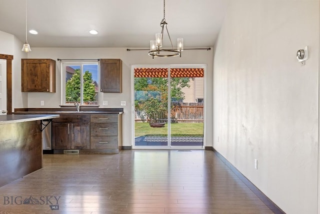 343 Stewart Loop, Bozeman, MT 59718 - kitchen with dark wood-style floors, a chandelier, and plenty of natural light
