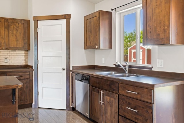343 Stewart Loop, Bozeman, MT 59718 - kitchen featuring stainless steel dishwasher, dark countertops, backsplash, and dark wood-style floors