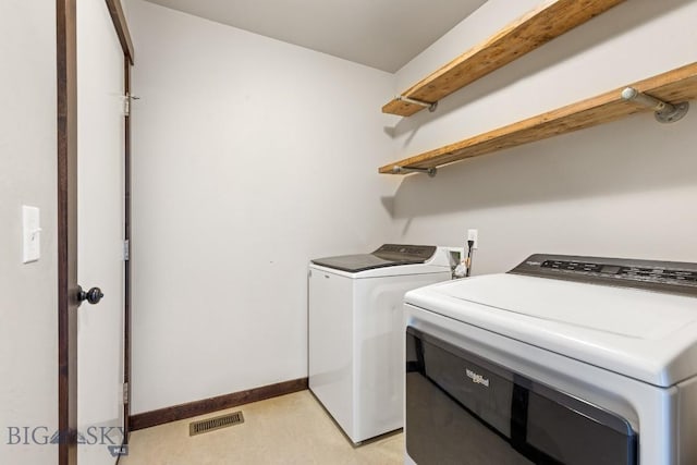 343 Stewart Loop, Bozeman, MT 59718 - laundry area with washing machine and clothes dryer and baseboards