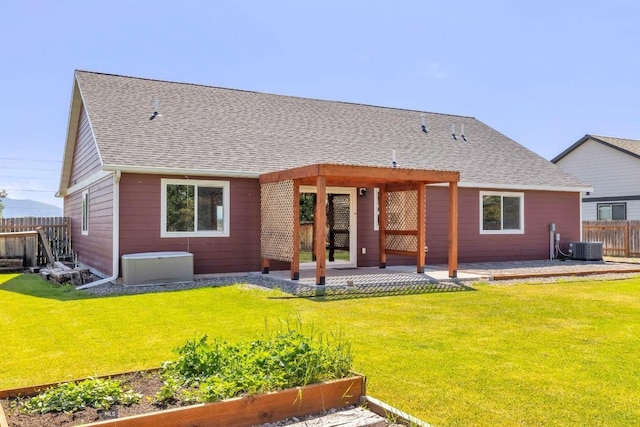 343 Stewart Loop, Bozeman, MT 59718 - rear view of property with a vegetable garden, a patio, and roof with shingles