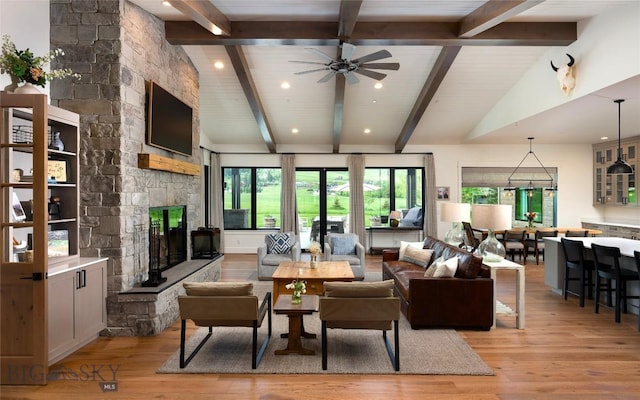 75 Vera Ct, Bozeman, MT 59718 - living area with light wood-style flooring, healthy amount of natural light, a ceiling fan, a fireplace, and recessed lighting