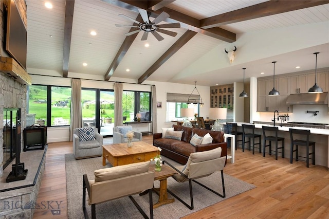 75 Vera Ct, Bozeman, MT 59718 - living area featuring light wood-style flooring, healthy amount of natural light, a ceiling fan, and recessed lighting
