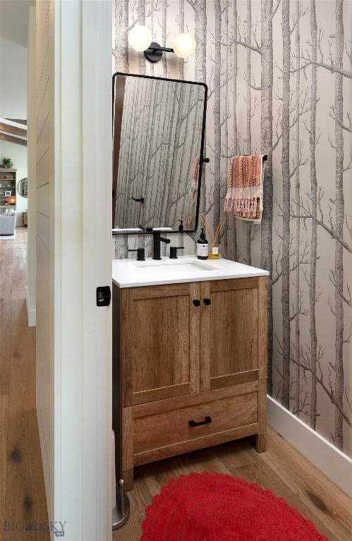 75 Vera Ct, Bozeman, MT 59718 - bathroom featuring wood finished floors and vanity