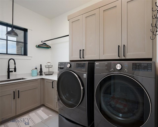 75 Vera Ct, Bozeman, MT 59718 - washroom with cabinet space, washer and clothes dryer, and light tile patterned floors