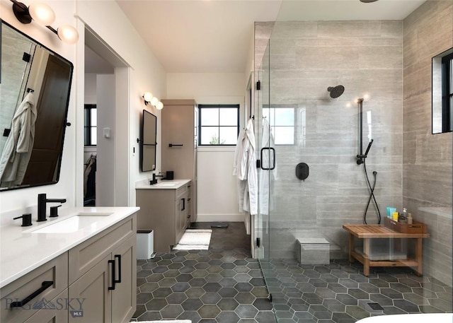 75 Vera Ct, Bozeman, MT 59718 - full bathroom with a stall shower, two vanities, and tile patterned flooring
