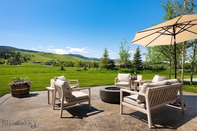 75 Vera Ct, Bozeman, MT 59718 - view of patio featuring a mountain view and an outdoor living space with a fire pit