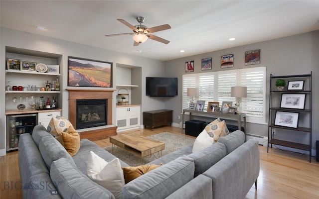 3214 Hillcrest Dr, Bozeman, MT 59715 - living room featuring beverage cooler, ceiling fan, light wood finished floors, a baseboard radiator, and recessed lighting