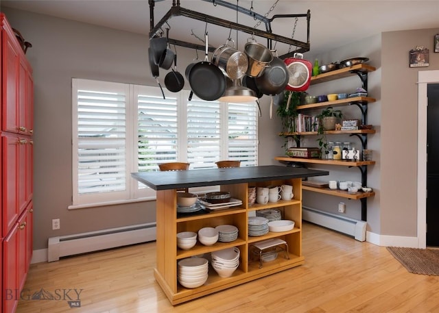 3214 Hillcrest Dr, Bozeman, MT 59715 - dining area featuring a baseboard heating unit and light wood-style floors