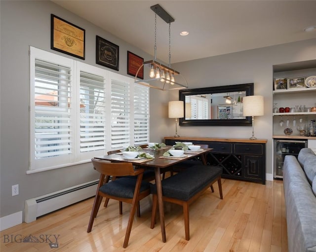 3214 Hillcrest Dr, Bozeman, MT 59715 - dining room with a baseboard radiator, wine cooler, light wood-type flooring, and recessed lighting