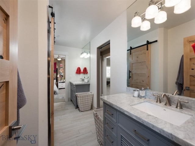 3214 Hillcrest Dr, Bozeman, MT 59715 - full bath featuring ensuite bathroom, vanity, and wood finished floors
