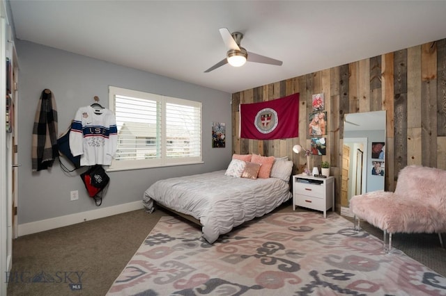 3214 Hillcrest Dr, Bozeman, MT 59715 - bedroom with wood walls, carpet, and a ceiling fan