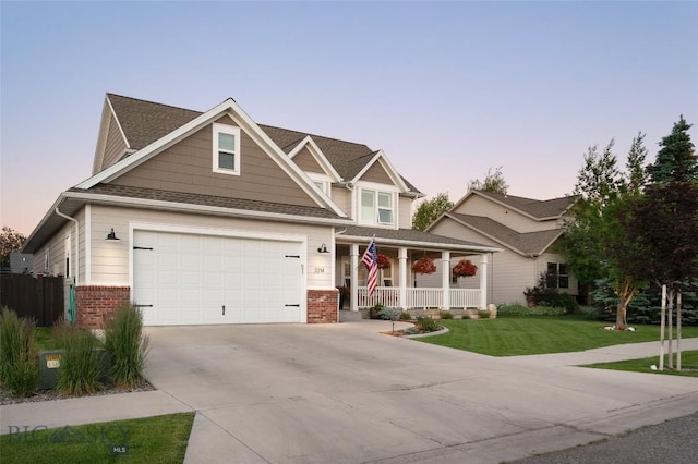 3214 Hillcrest Dr, Bozeman, MT 59715 - craftsman-style home featuring a porch, brick siding, concrete driveway, and a garage